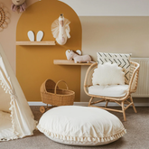 Grand coussin de sol avec pompons